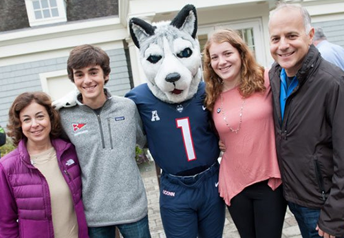 family with parents, students and uconn husky mascot